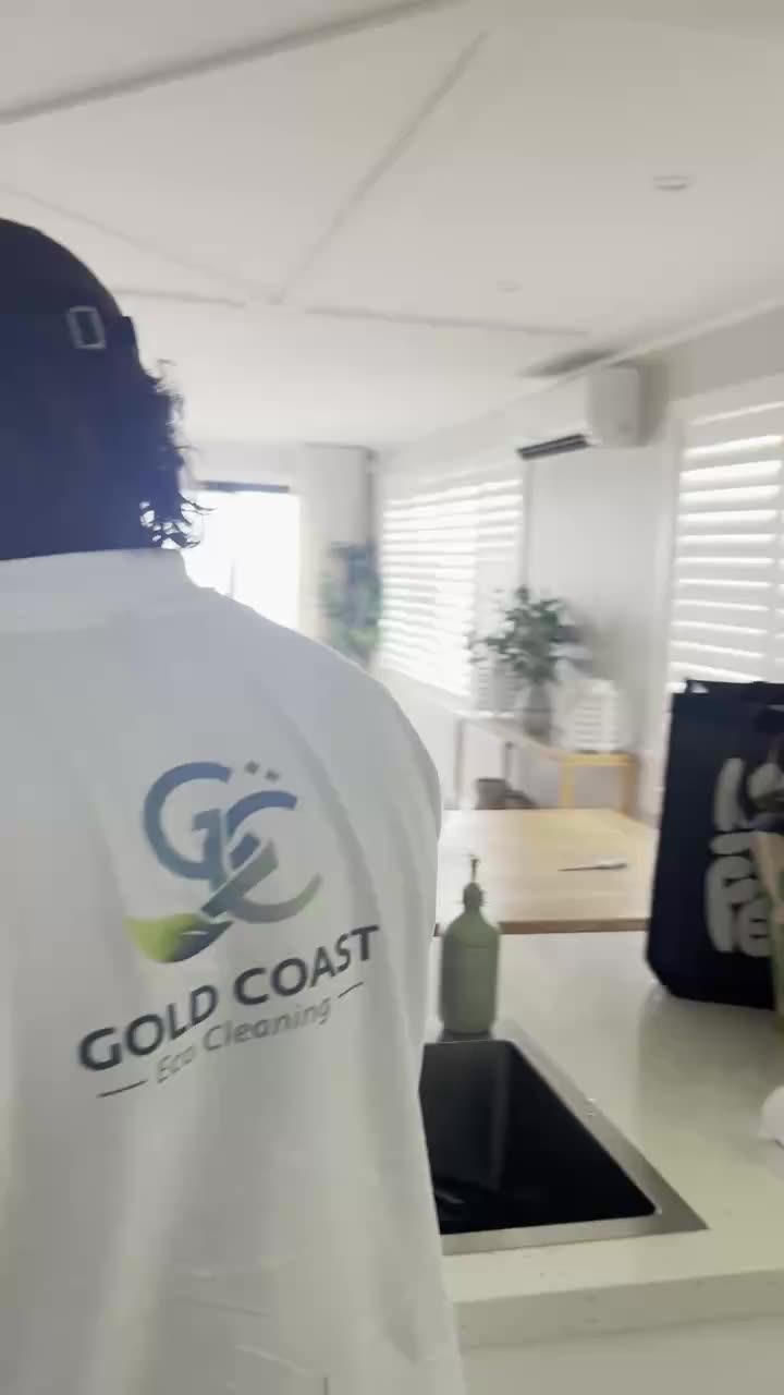 Gold Coast Eco Cleaning team member walking through a beachfront home